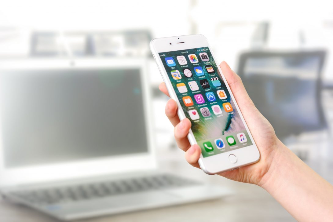 Hand holding iPhone