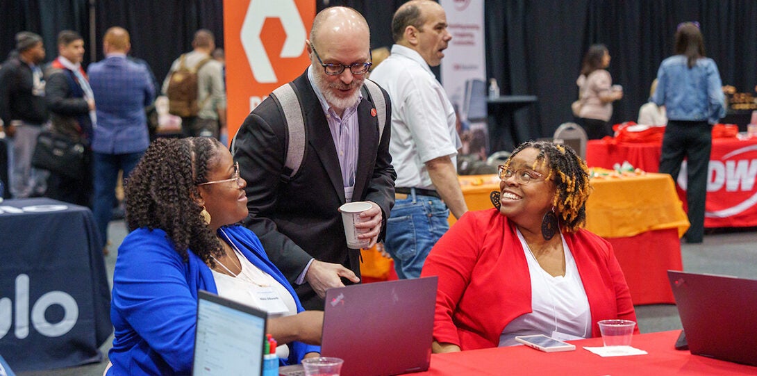 Technnology Solutions team table chatting