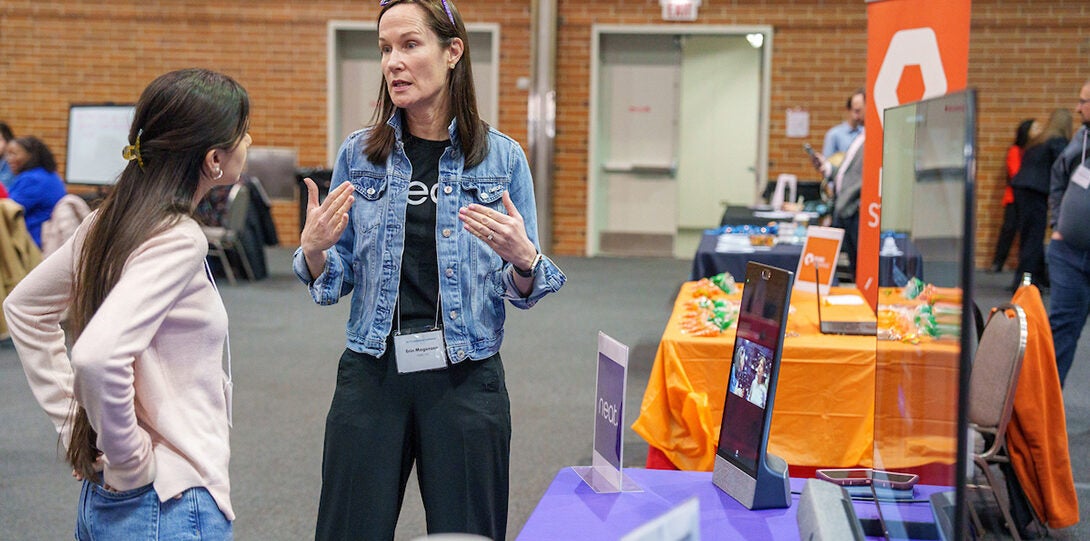 ITCC Attendee speaking with vendor