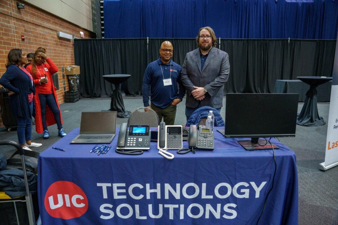 Gerry Taylor, Network VoIP Administrator and Bill Sullivan, Lead VoIP Engineer at the Zoom Phone table