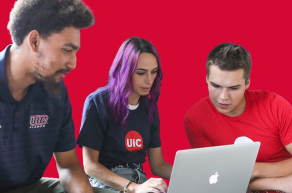 students looking at laptop