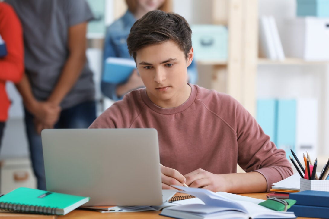 Student looking at laptop