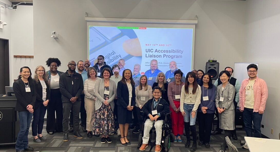 A group of people posing in a room for the U I C Accessibility Liaison Program 2 Day workshop.