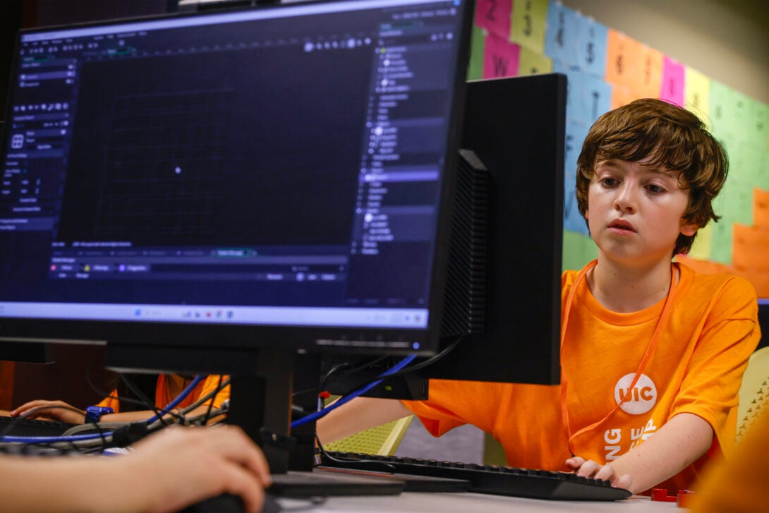 Camp students coding on computer