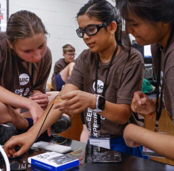 Camp Participants performing engineering task
                  