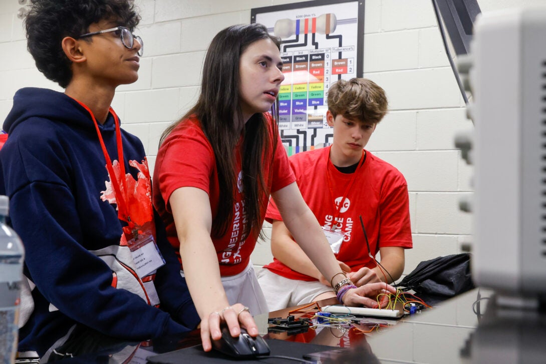 Students collaborating on laptop