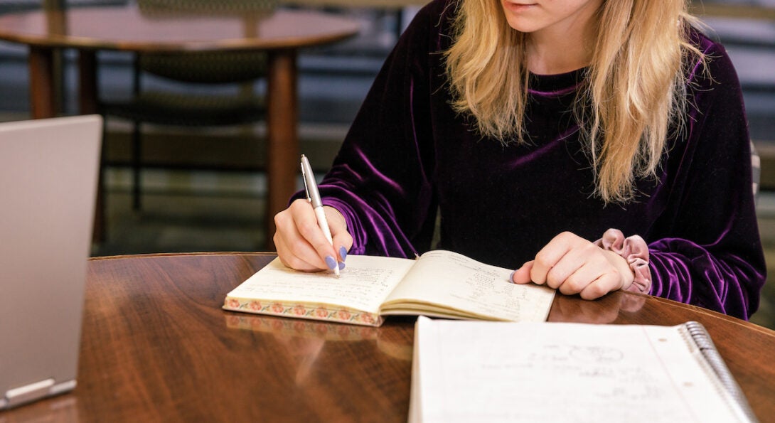 student making notes