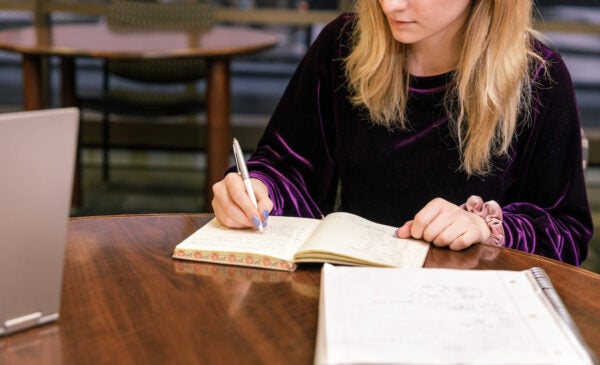 student making notes