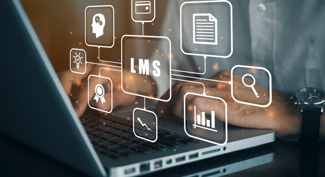 Virtual icons over a laptop to represent Learning Management System