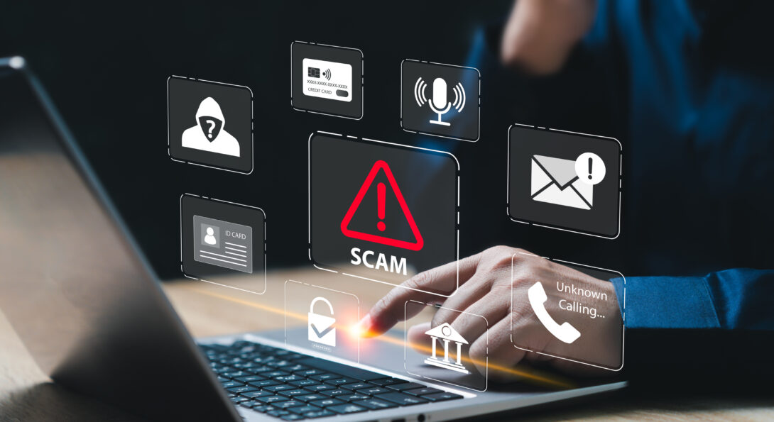 A hand clicking on the keyboard of a laptop and icons of phishing email scams