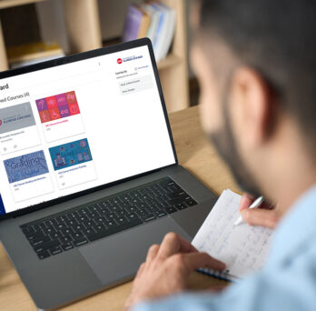Laptop with the UIC Canvas home page on the screen
                  